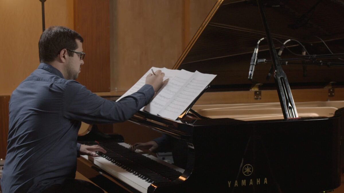 Justin Gray composing at the piano